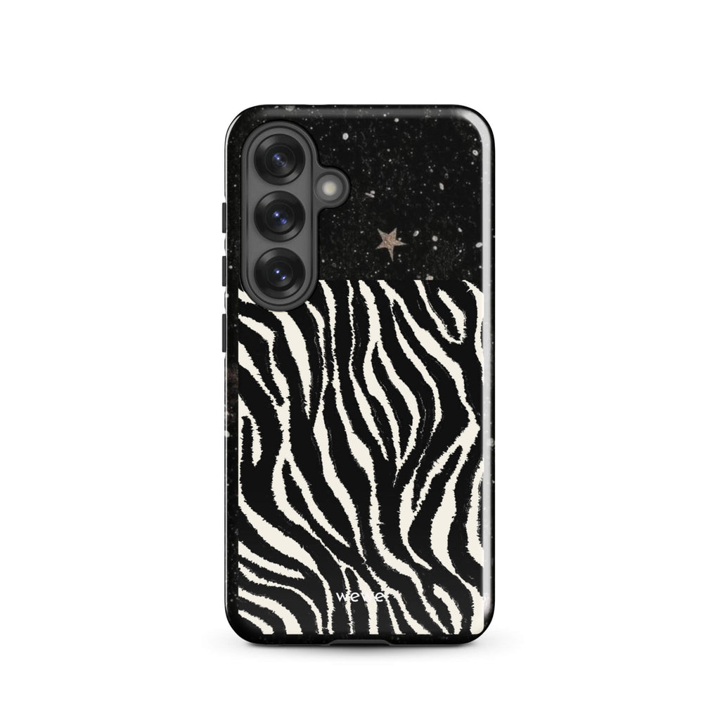 Custom samsung galaxy s25 with a black, glittery cosmic/galaxy top half with stars, and a bold black and white zebra stripe pattern on the bottom half.