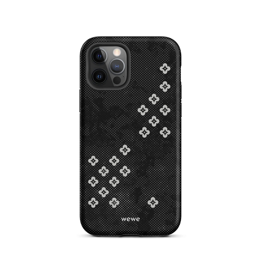 Custom iPhone case 12 pro with a  black lace background with white plum-style crosses.