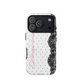 White phone case with small black polka dots, black floral lace border and pastel pink cursive lettering