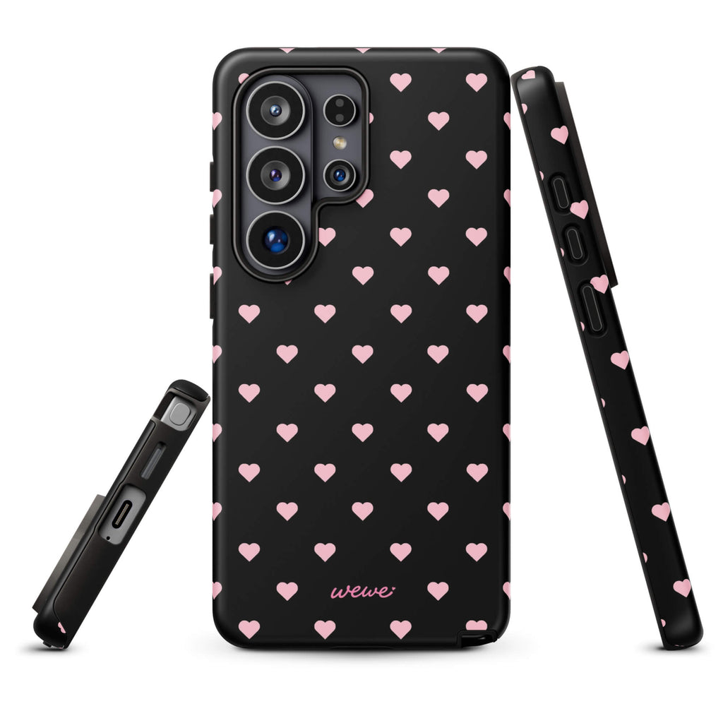 Black iPhone case with evenly spaced soft-pink mini hearts