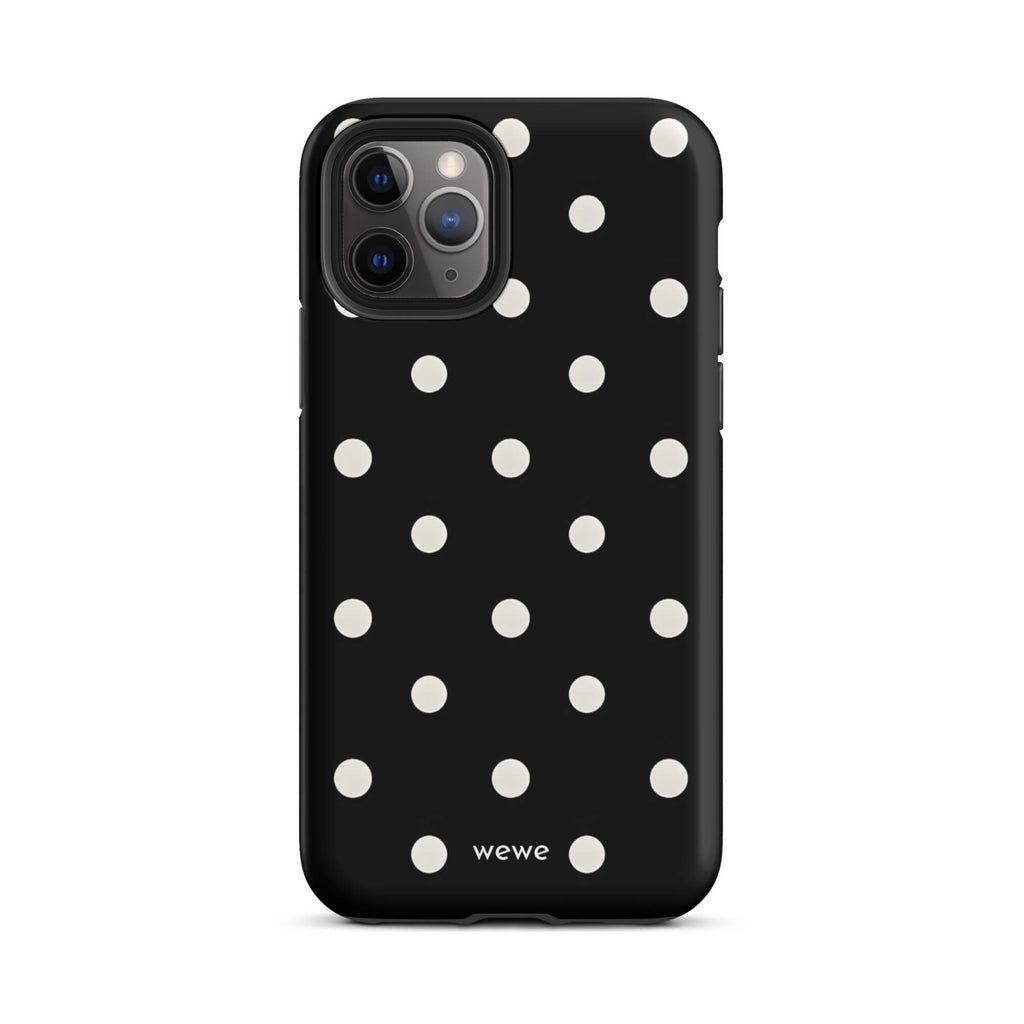 Custom iPhone case 11 pro with a black background and a pattern of small white polka dots.