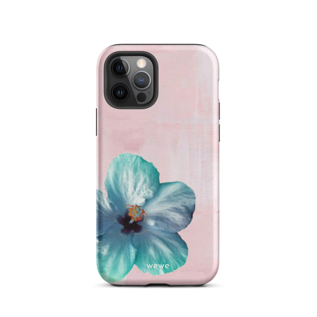 Custom iPhone case 12 pro with a photo of a blue hibiscus flower with a green center on a soft pink painted 