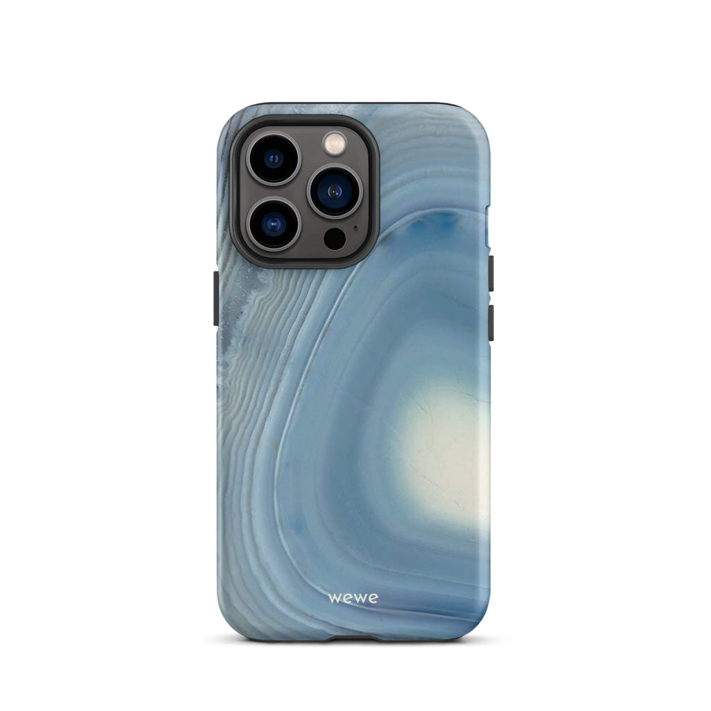 Custom iPhone case 13 pro with a  close-up image of a blue and white geode or agate slice with swirling patterns.