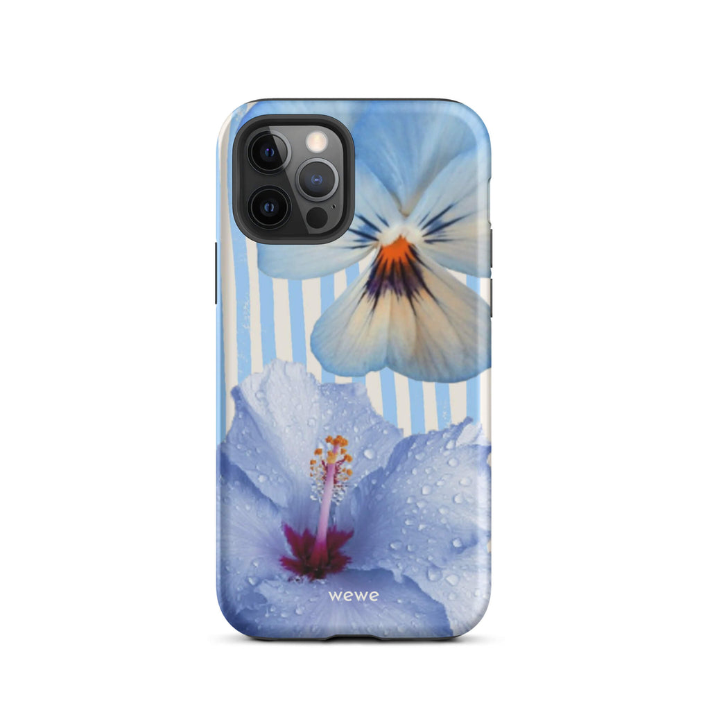 Custom iPhone case 12 pro with a photo of a blue hibiscus flower with water droplets and a white pansy on a striped background.