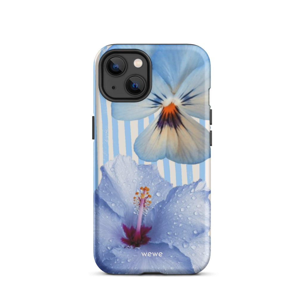 Custom iPhone case 13 with a photo of a blue hibiscus flower with water droplets and a white pansy on a striped background.