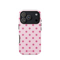 Blush-pink iPhone case with evenly spaced raspberry-pink polka dots