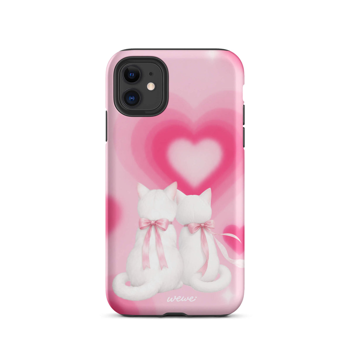 Blush-pink iPhone case with two white cats, pink bows and a layered soft-focus heart