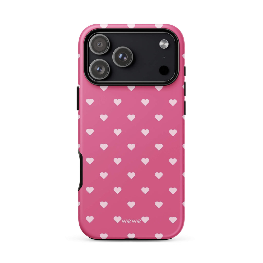 Bubblegum-pink iPhone case with evenly spaced pale blush-pink mini hearts