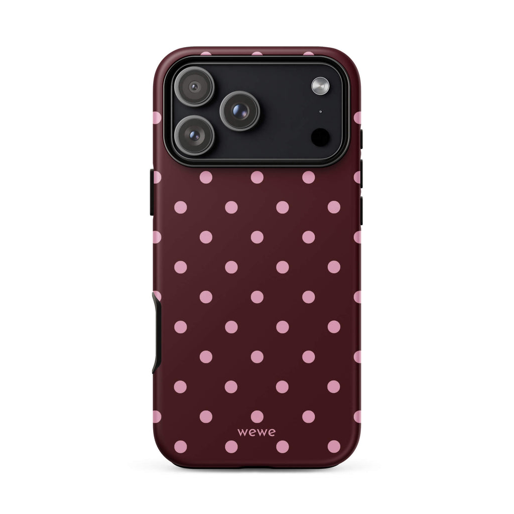 Deep burgundy iPhone case with evenly spaced soft-pink polka dots