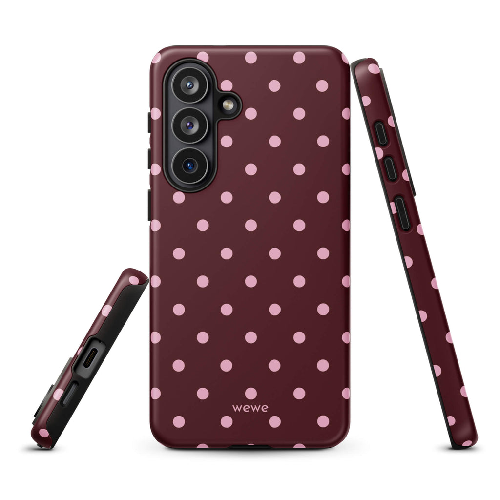 Deep burgundy iPhone case with evenly spaced soft-pink polka dots
