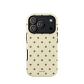 Butter yellow iPhone case with evenly spaced cocoa-brown mini polka dots