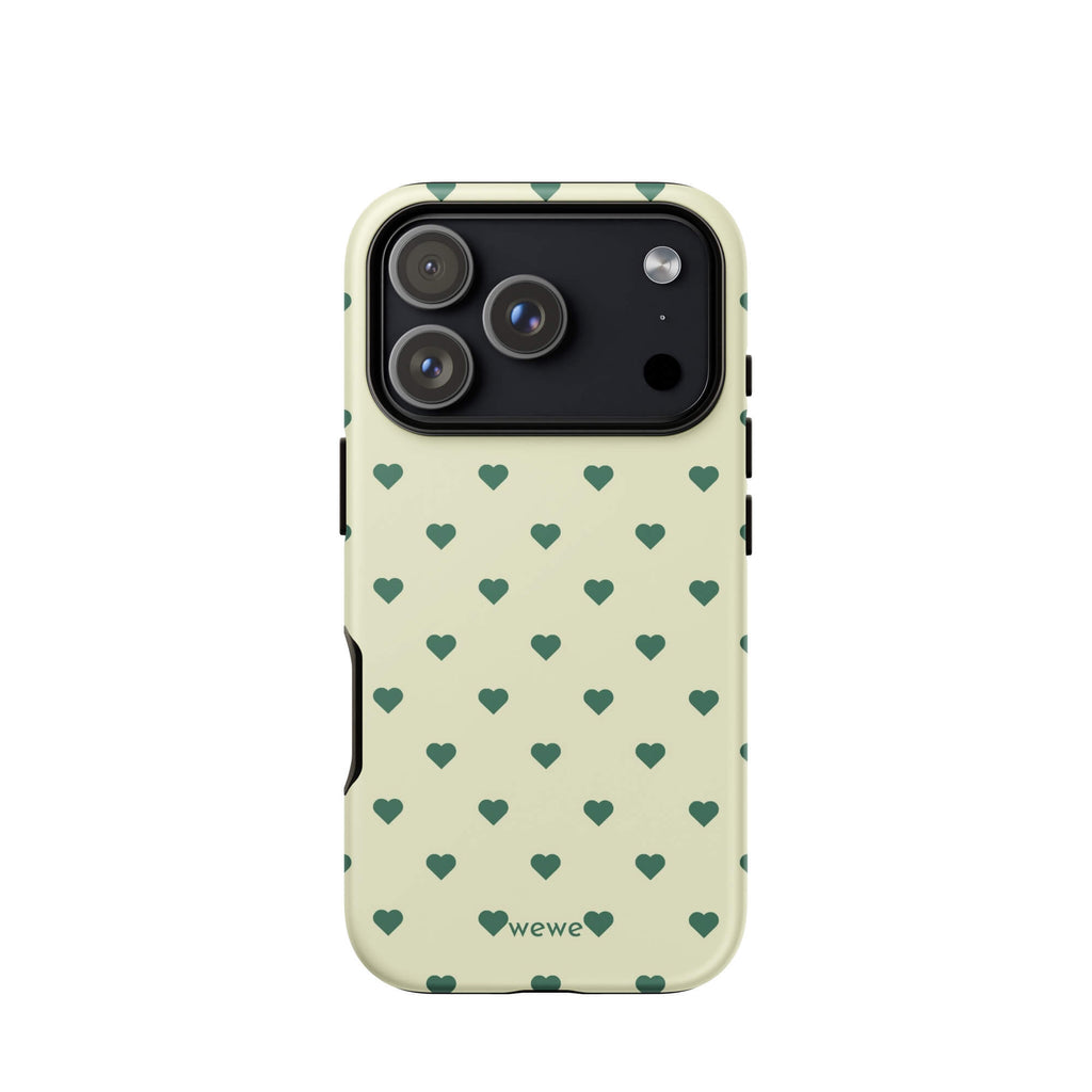 Pale buttercream iPhone case with evenly spaced forest-green mini hearts