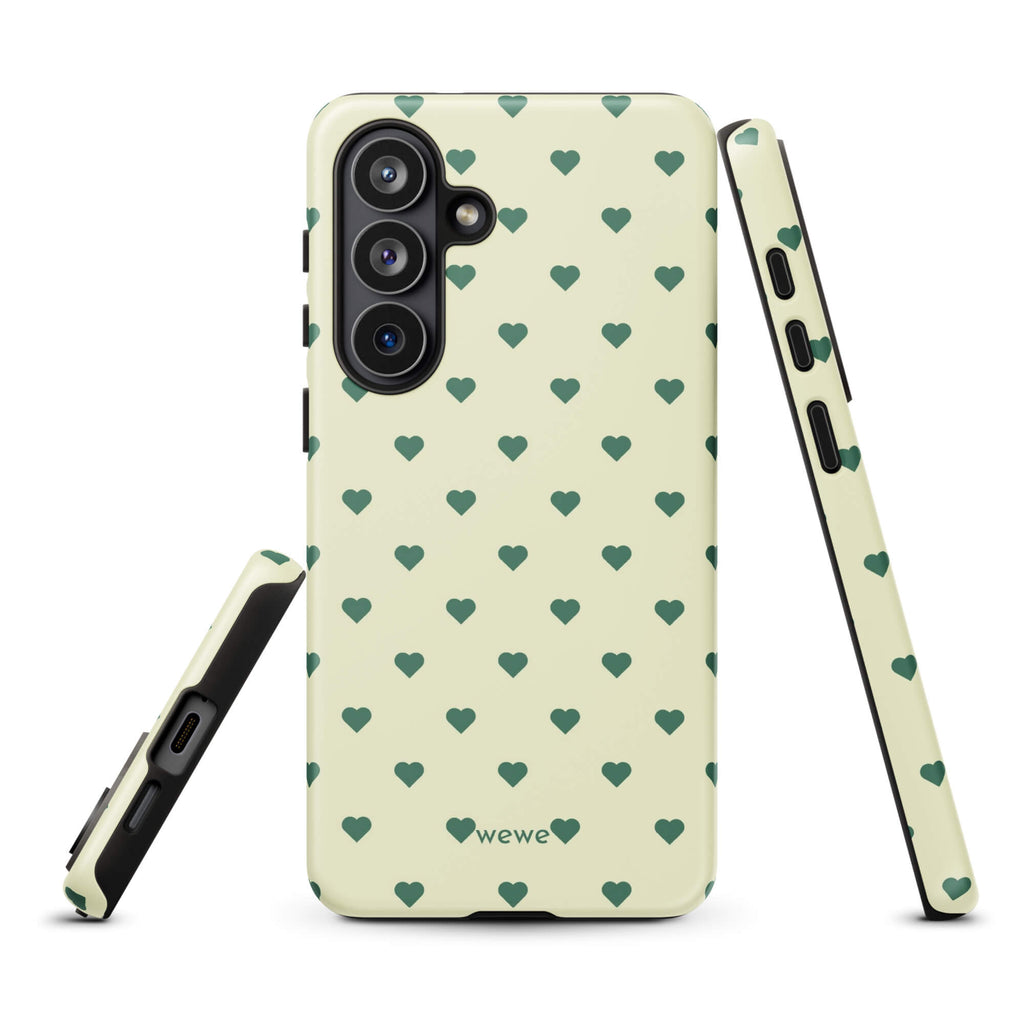 Pale buttercream iPhone case with evenly spaced forest-green mini hearts