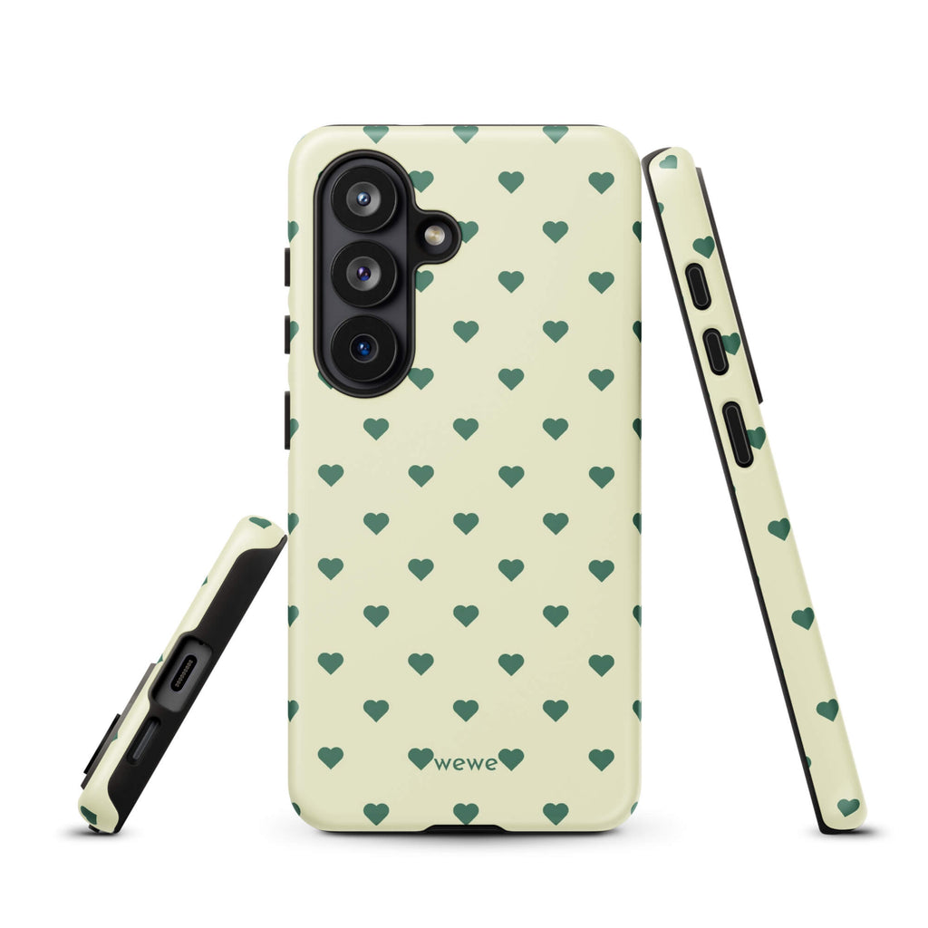 Pale buttercream iPhone case with evenly spaced forest-green mini hearts