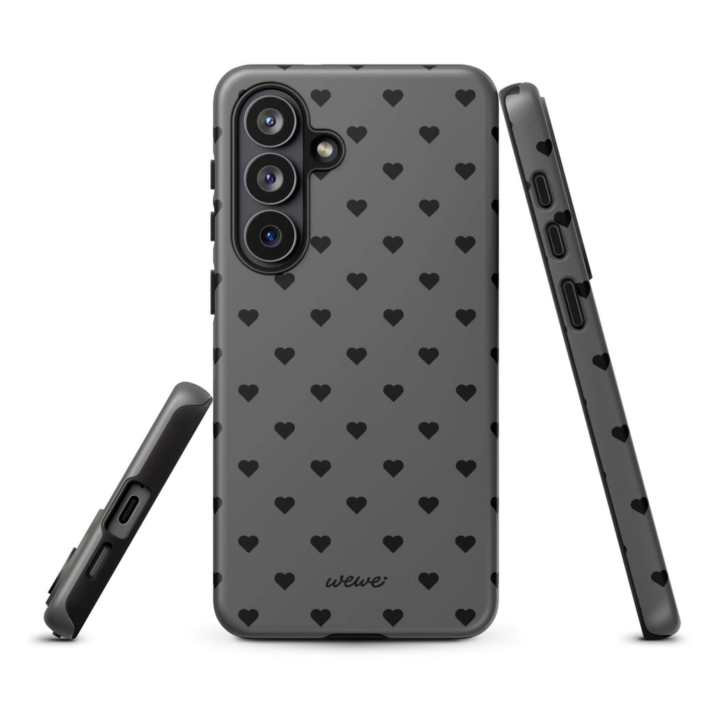 Charcoal-gray iPhone case with evenly spaced black mini hearts