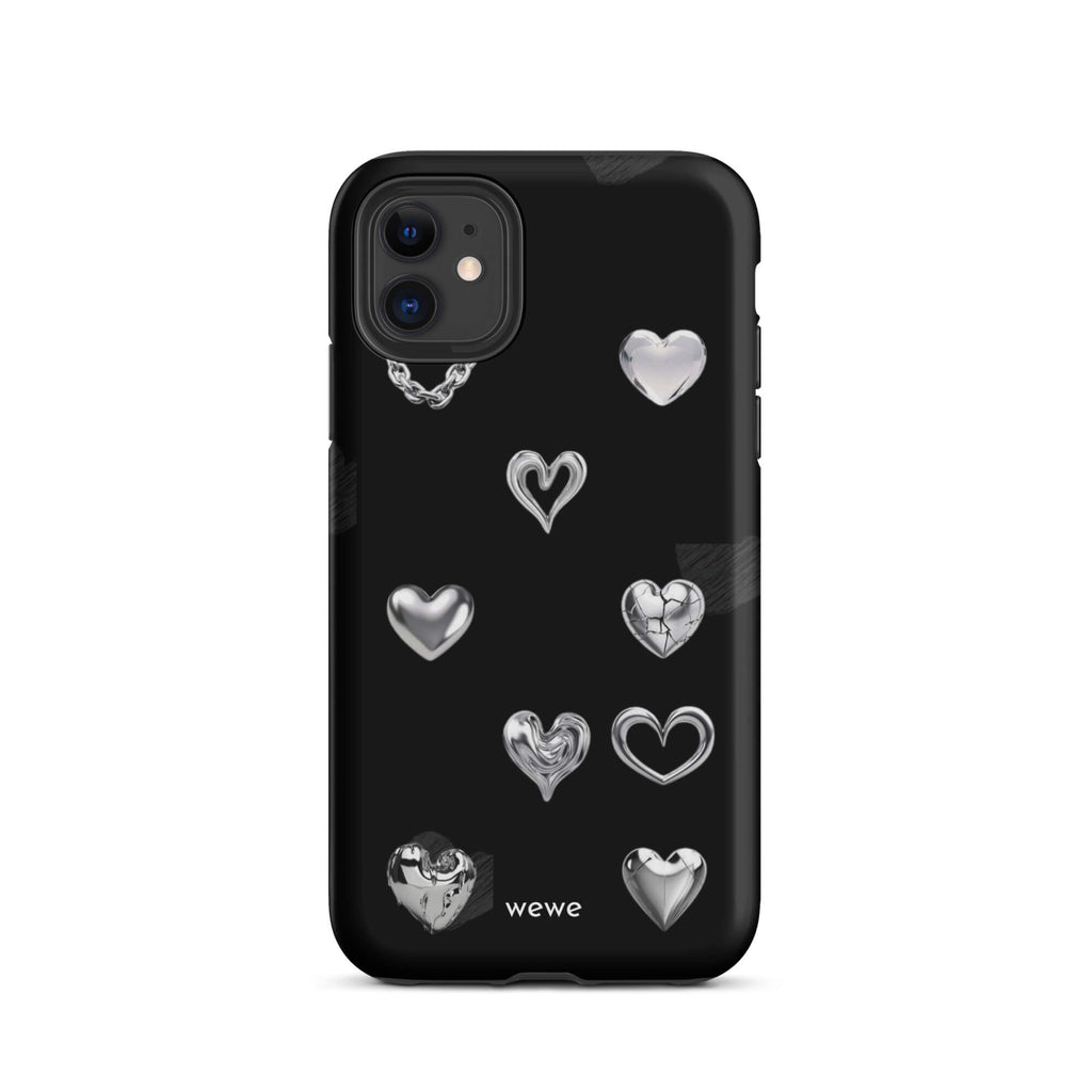 Custom iPhone case 11 with a black background and shiny silver chrome heart charms in various designs, including a cracked heart.
