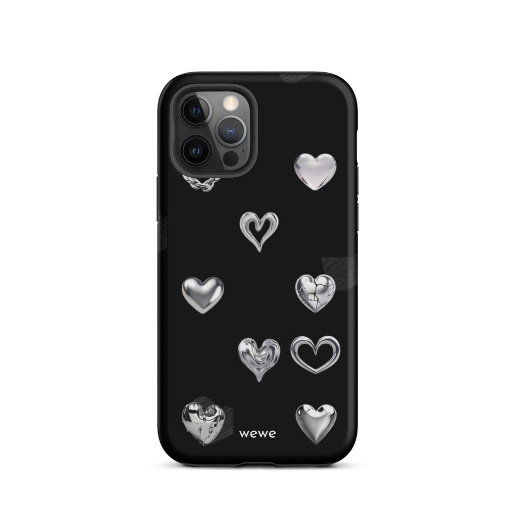 Custom iPhone case 12 pro with a black background and shiny silver chrome heart charms in various designs, including a cracked heart.