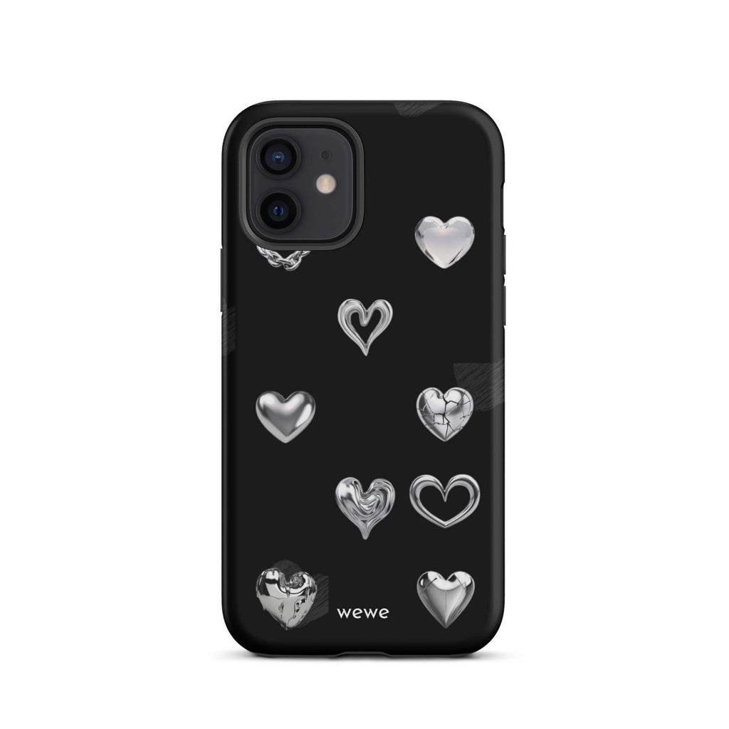 Custom iPhone case 12 with a black background and shiny silver chrome heart charms in various designs, including a cracked heart.
