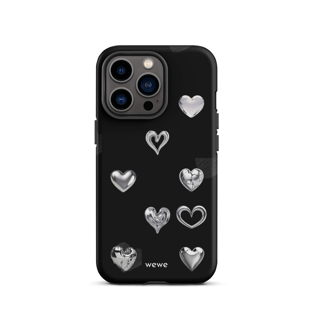 Custom iPhone case 13 pro with a black background and shiny silver chrome heart charms in various designs, including a cracked heart.