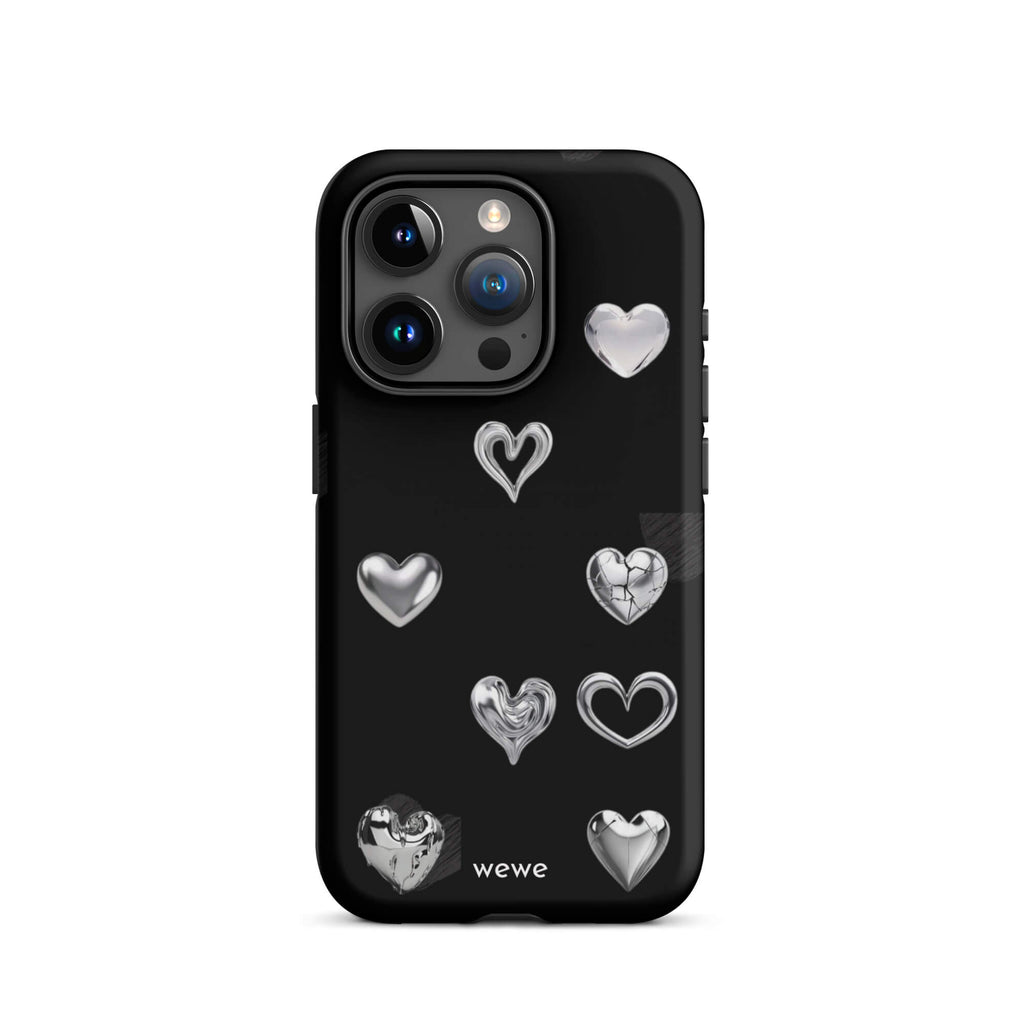 Custom iPhone case 15 pro with a black background and shiny silver chrome heart charms in various designs, including a cracked heart.
