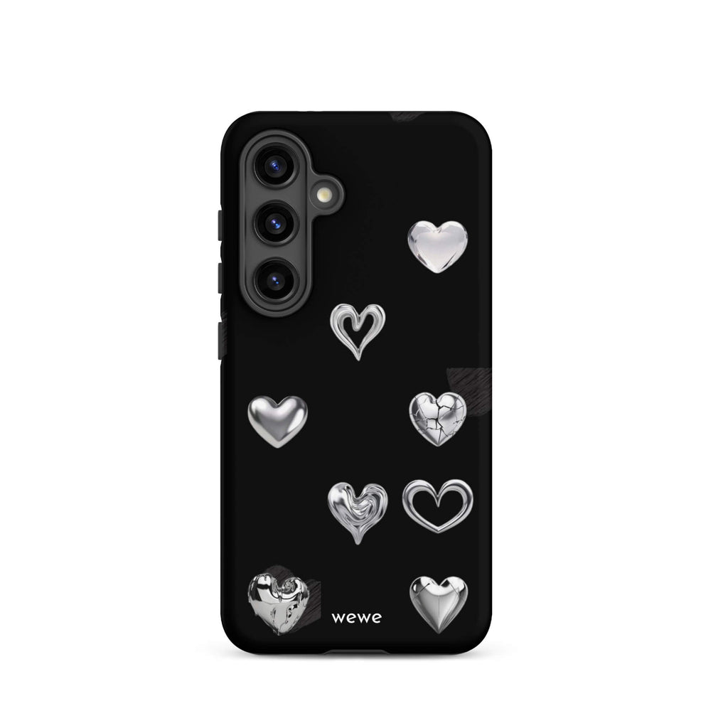Custom samsung galaxy s24 Phone case with a black background and shiny silver chrome heart charms in various designs, including a cracked heart.