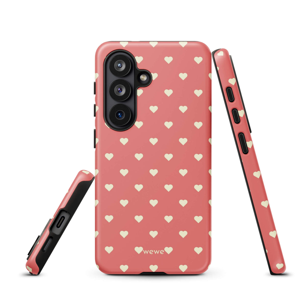 Coral-pink iPhone case with evenly spaced soft-cream mini hearts