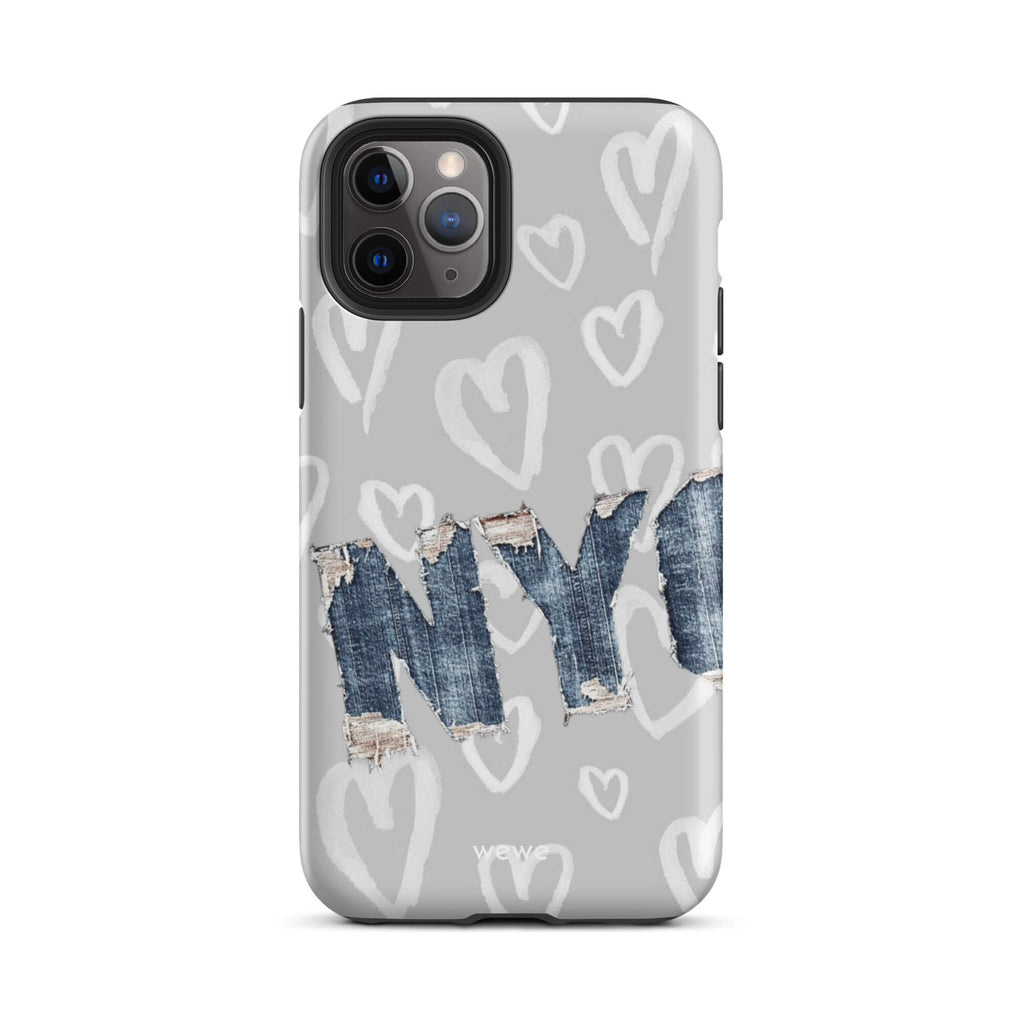 Custom iPhone case 11 pro with a light grey background, a pattern of sketched white hearts, and a ripped denim 'NY' graphic.