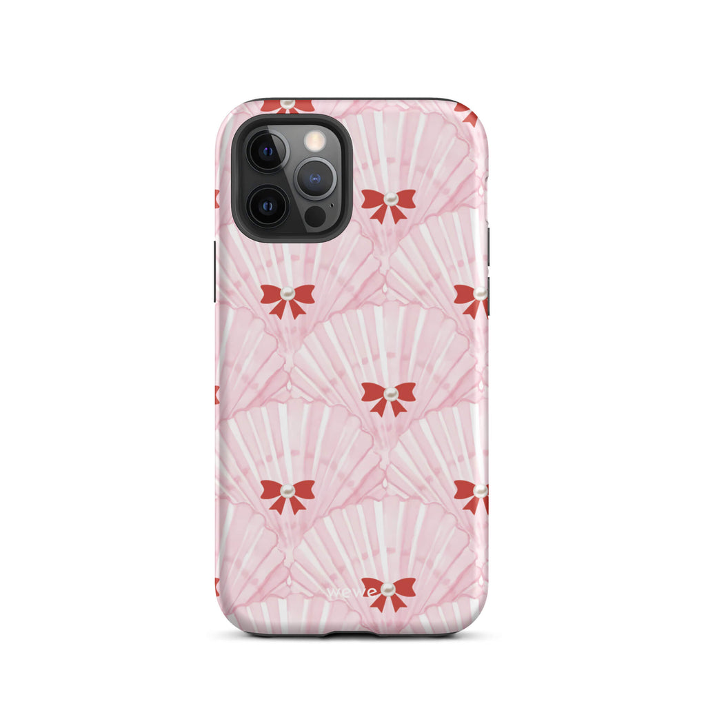 Custom iPhone case 12 pro with a cute and whimsical pattern of watercolor pink and white seashells with red bows and pearls.