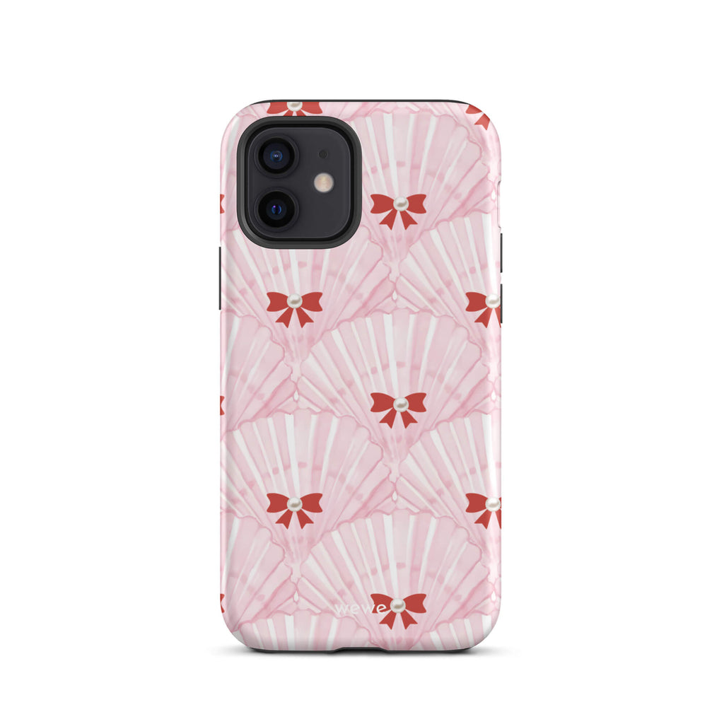 Custom iPhone case 12 with a cute and whimsical pattern of watercolor pink and white seashells with red bows and pearls.