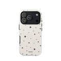 Warm ivory iPhone case with scattered black five-point stars in mixed sizes