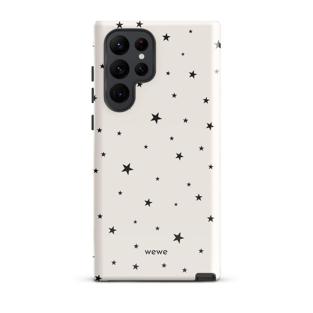 Warm ivory iPhone case with scattered black five-point stars in mixed sizes