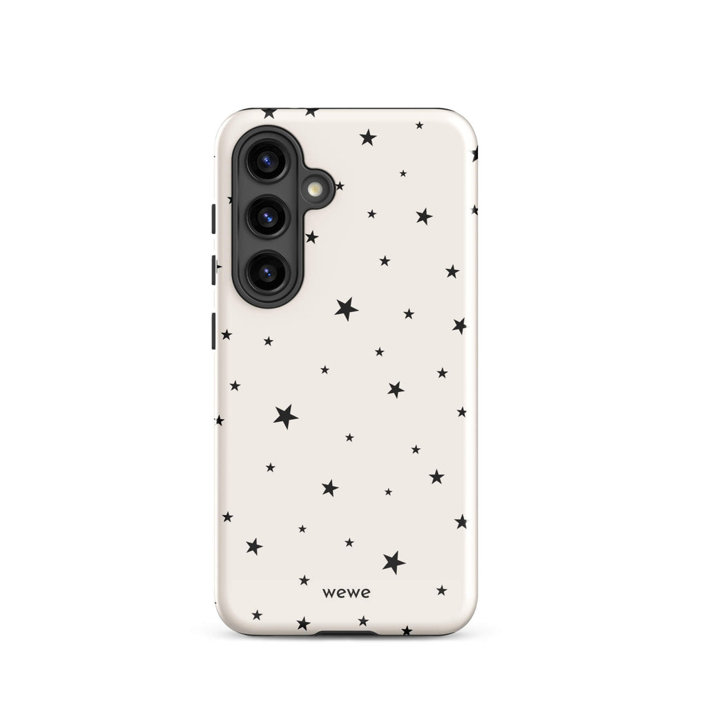 Warm ivory iPhone case with scattered black five-point stars in mixed sizes