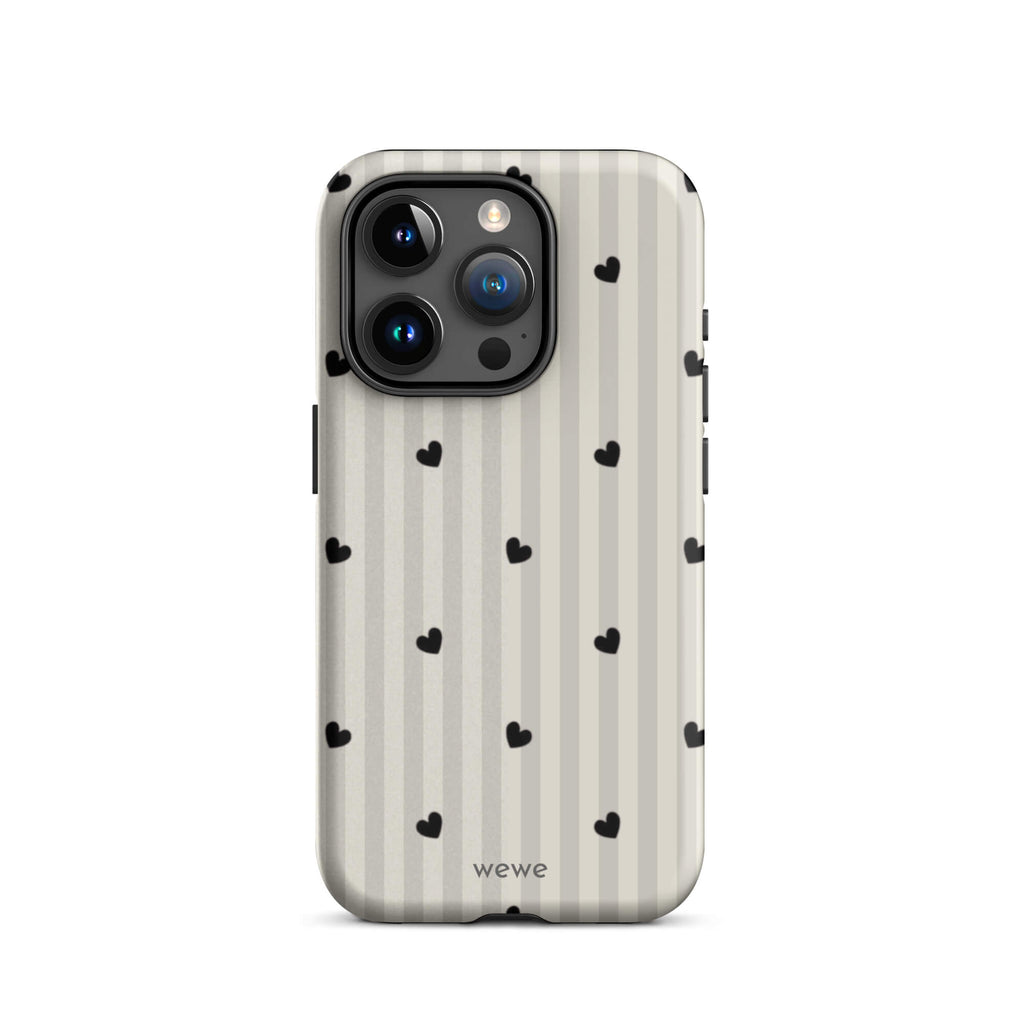 Custom iPhone case 15 pro with a subtle beige and white vertical stripe background, scattered black hearts.