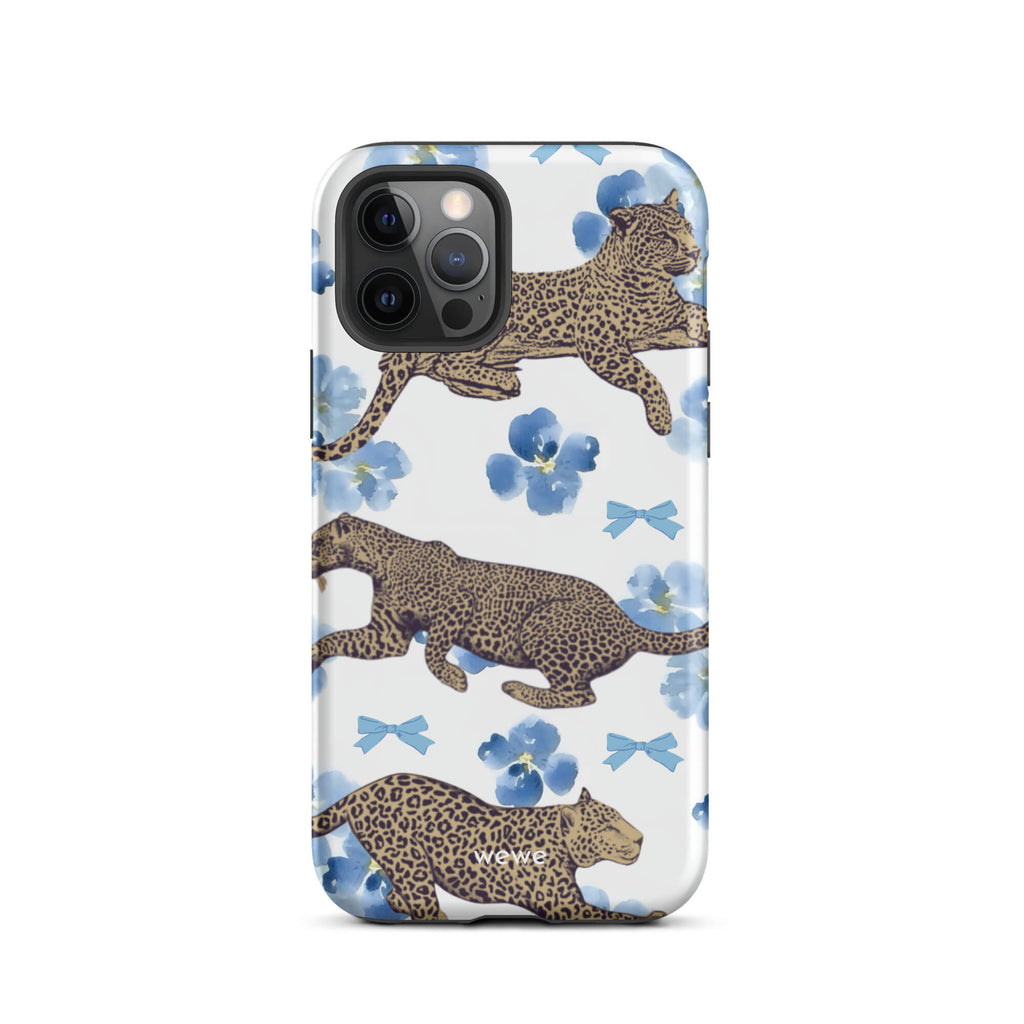 Custom iPhone case 12 pro with a cute pattern of leopard print cheetahs, blue pansies, and small ribbons on a white background.