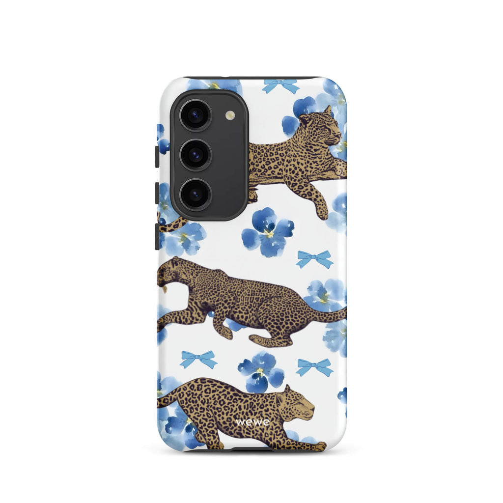 Custom samsung galaxy s23 Phone case with a cute pattern of leopard print cheetahs, blue pansies, and small ribbons on a white background.