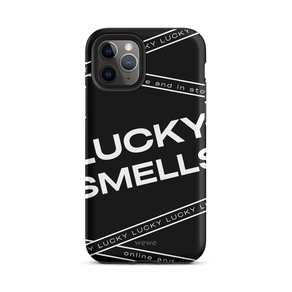 Custom iPhone case 11 pro with a black background and white typography that says "LUCKY SMELLS" and "online and in sto".