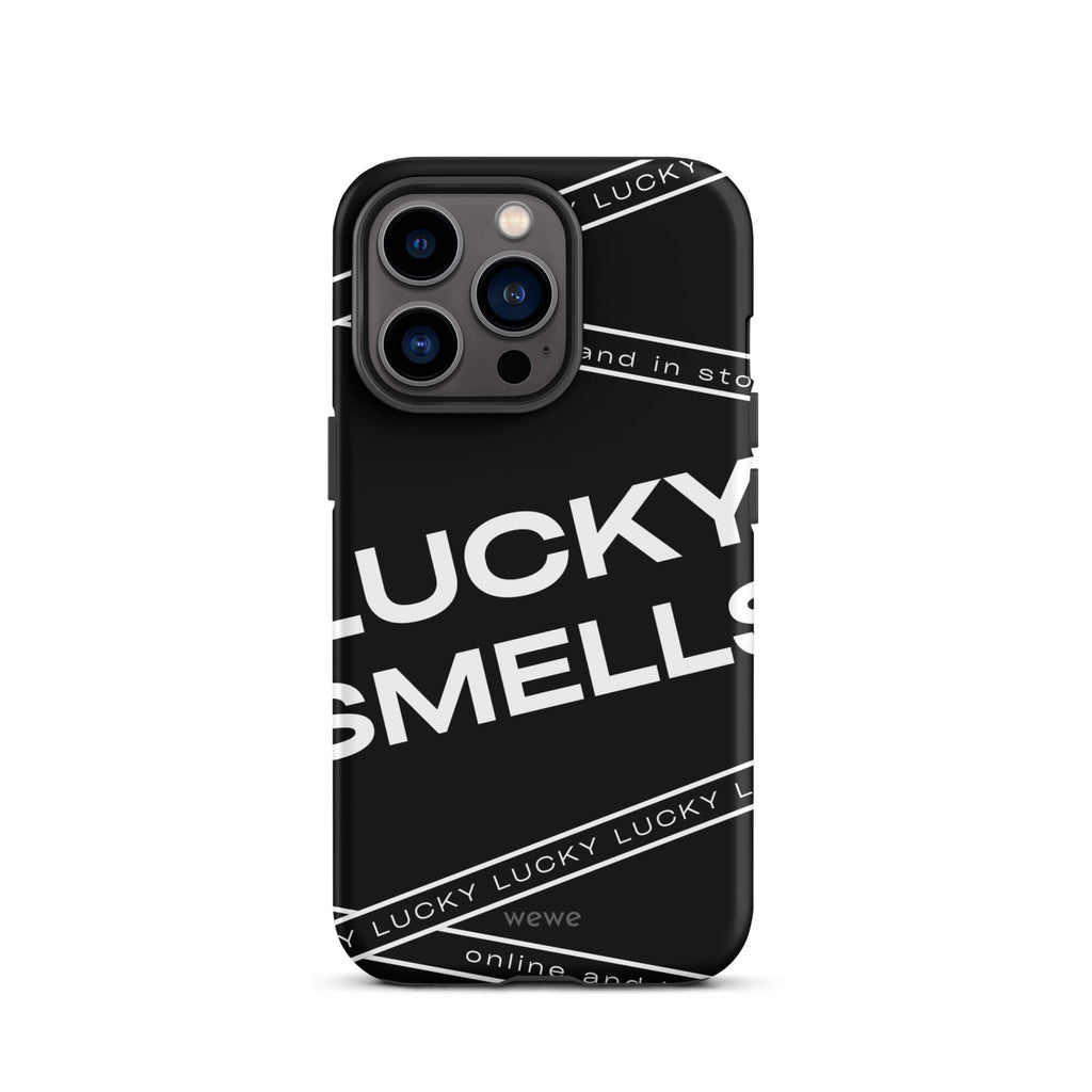 Custom iPhone case 13 pro with a black background and white typography that says "LUCKY SMELLS" and "online and in sto".