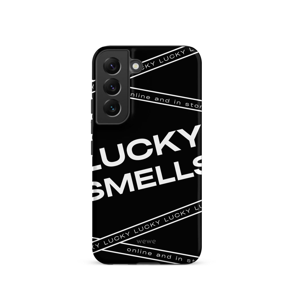 Custom samsung galaxy s22 Phone case with a black background and white typography that says "LUCKY SMELLS" and "online and in sto".