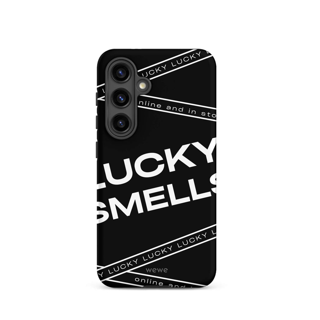 Custom samsung galaxy s24 Phone case with a black background and white typography that says "LUCKY SMELLS" and "online and in sto".