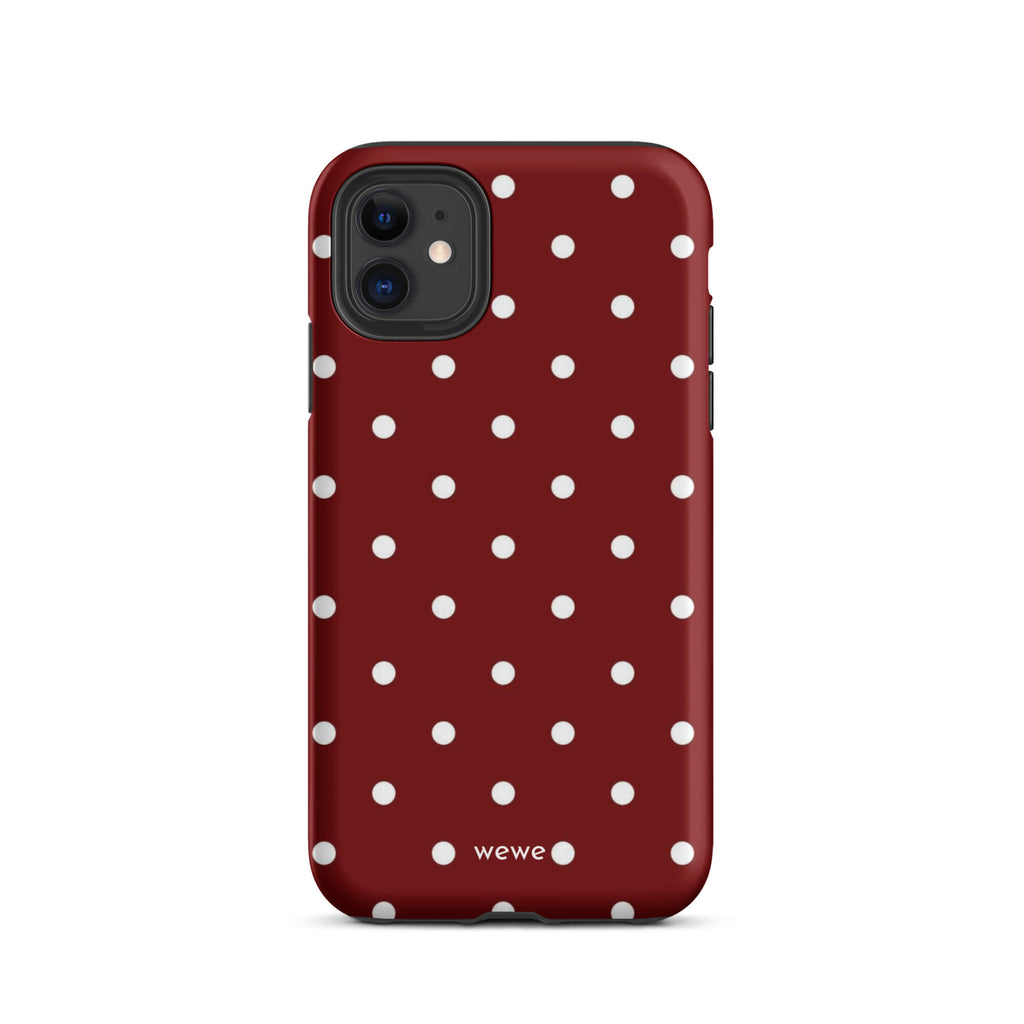 Custom iPhone case 11 with a maroon red background and a pattern of small white polka dots.