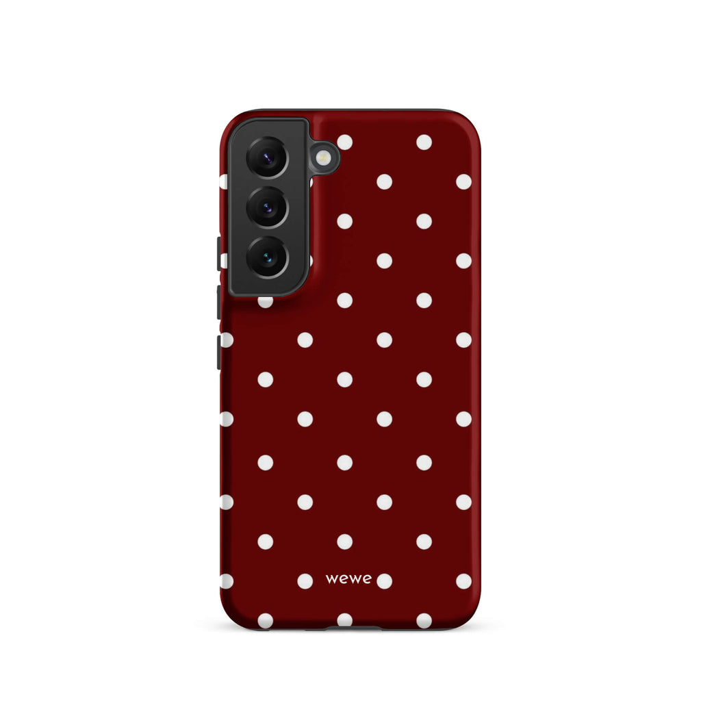 Custom samsung galaxy s22 Phone case with a maroon red background and a pattern of small white polka dots.
