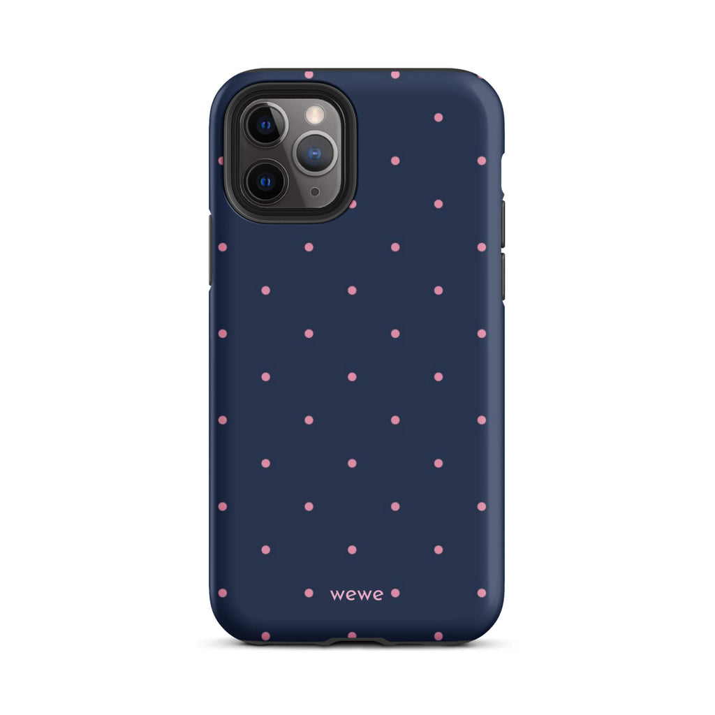 Custom iPhone case 11 pro with a dark navy blue background and a pattern of small pink polka dots.