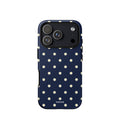 Navy blue iPhone case with evenly spaced cream-white polka dots