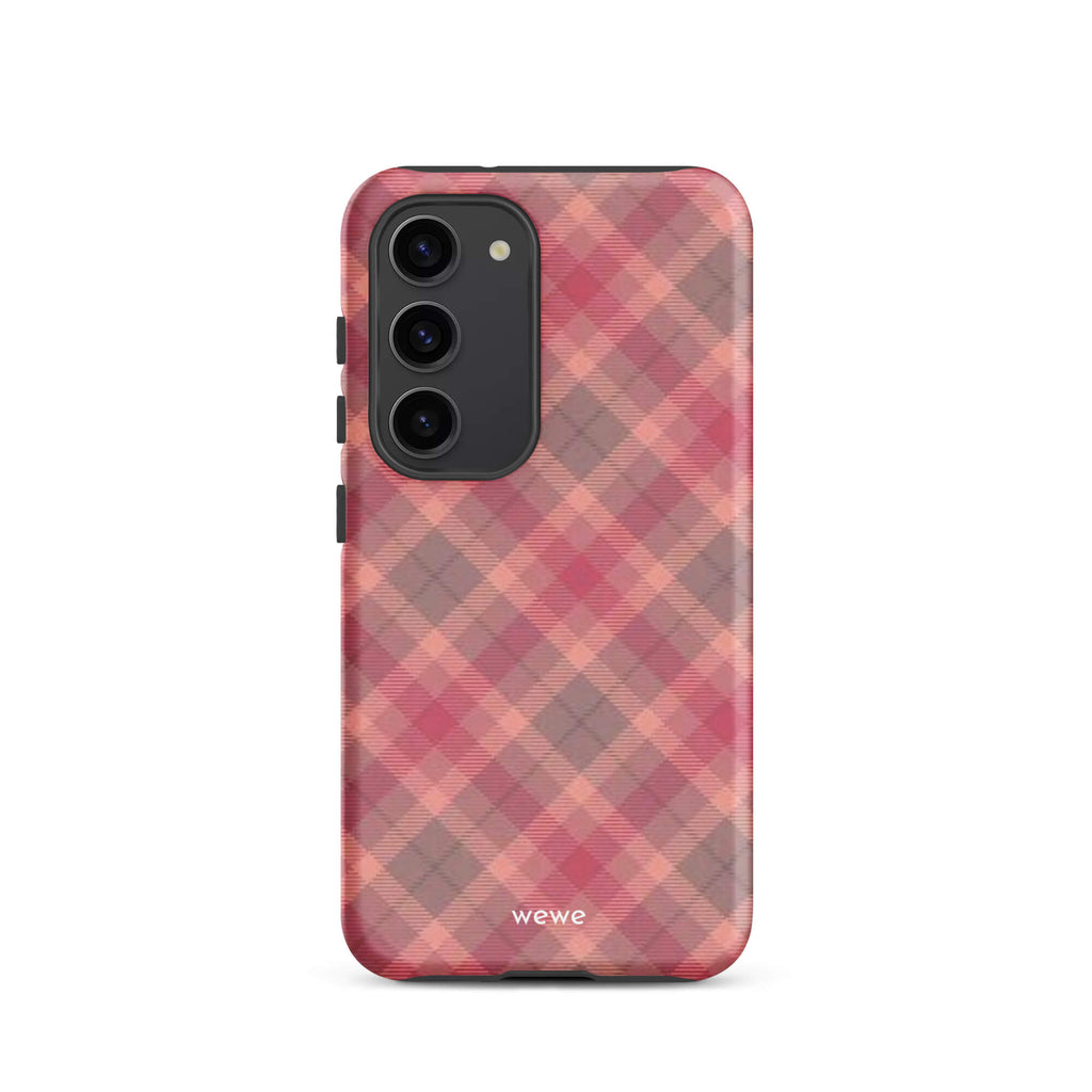 Custom samsung galaxy s23 with a soft, faded checkered pattern of pink, mauve, and gray diagonal lines, resembling a classic tartan plaid.
