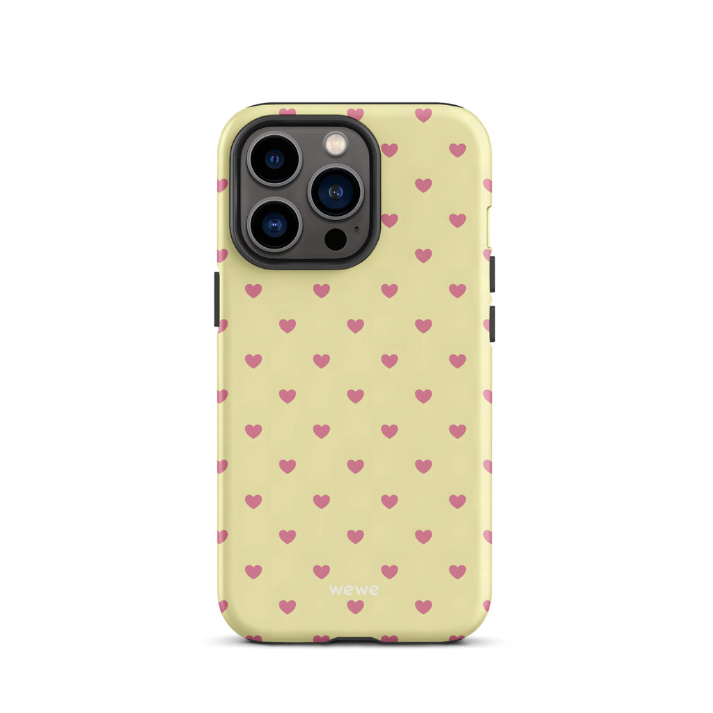 Custom iPhone case 13 pro with a light yellow background and a scattered pink heart pattern.