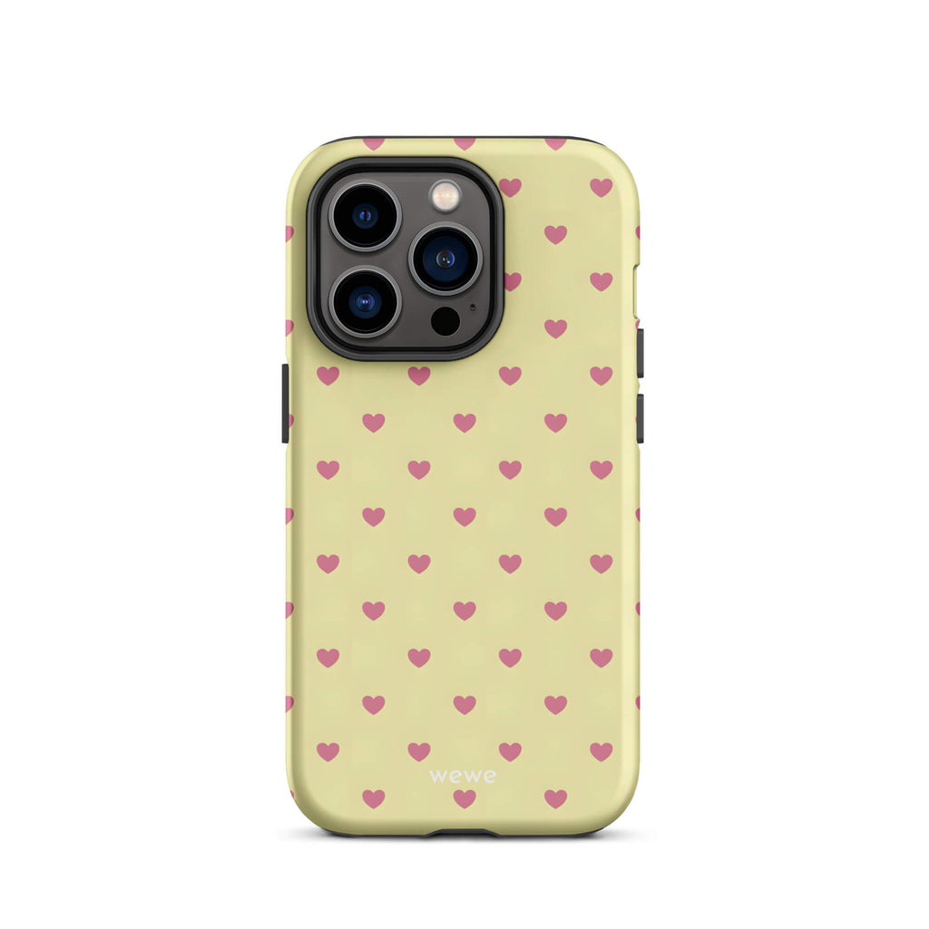 Custom iPhone case 14 pro with a light yellow background and a scattered pink heart pattern.