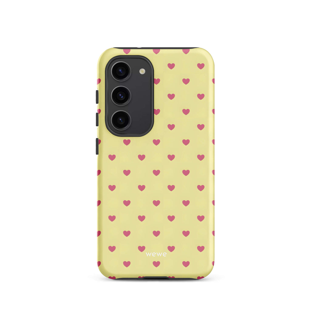 Custom samsung galaxy s23 Phone case with a light yellow background and a scattered pink heart pattern.