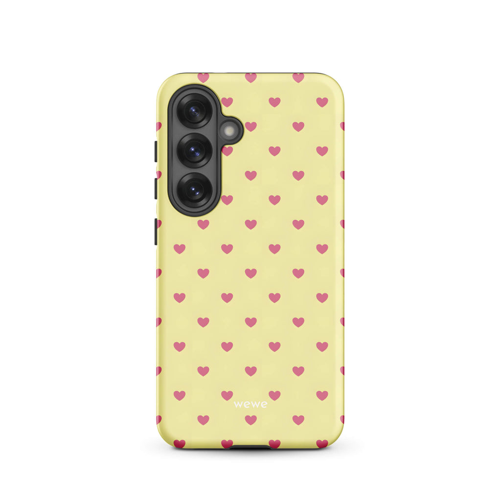 Custom samsung galaxy s25 Phone case with a light yellow background and a scattered pink heart pattern.