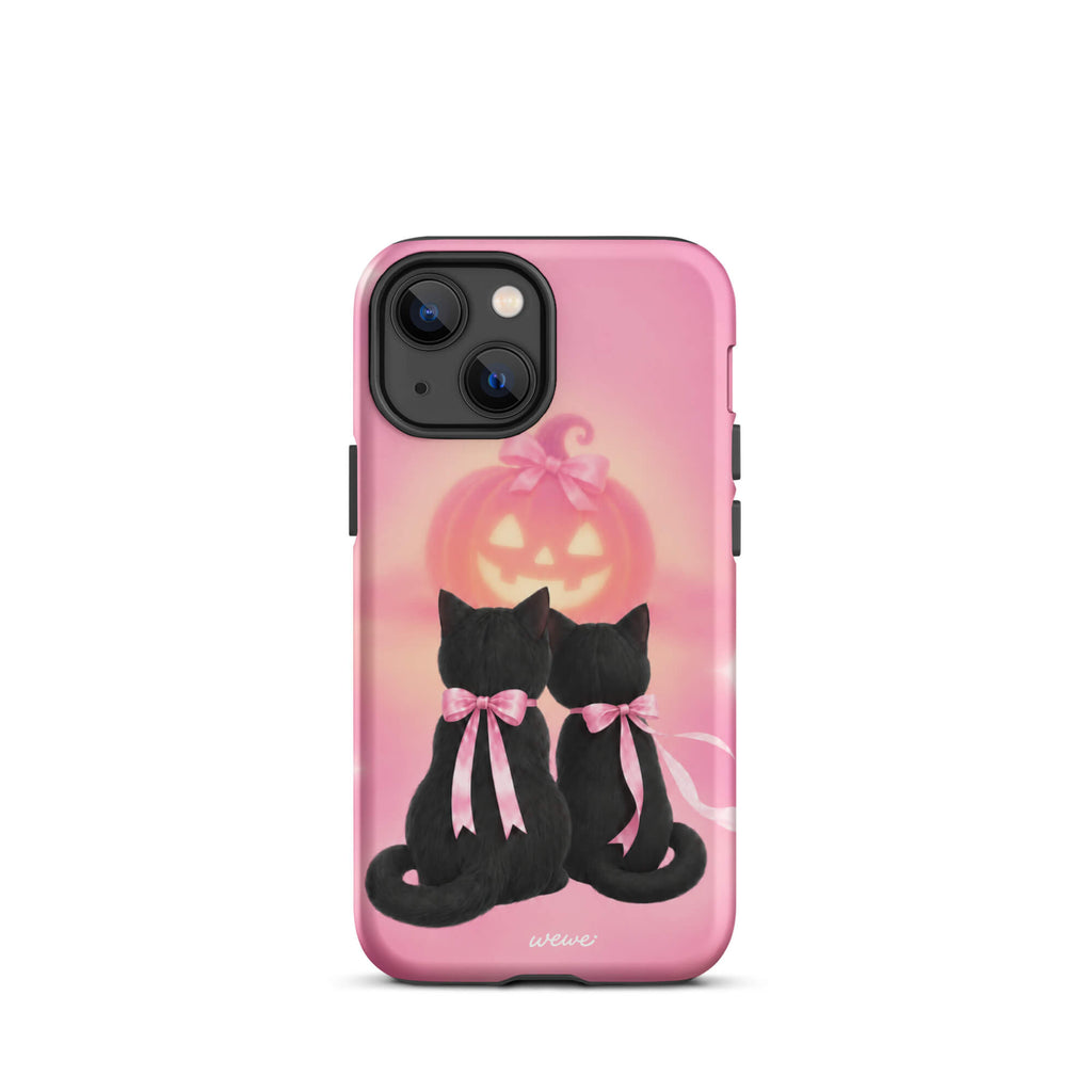 Bubblegum-pink iPhone case with two black cats wearing pink bows and a glowing jack-o-lantern