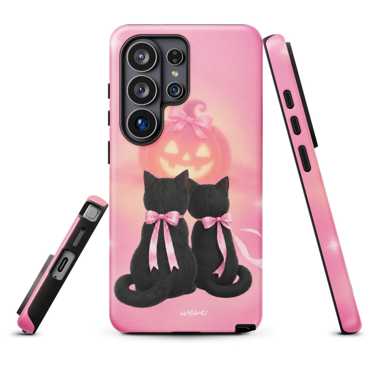 Bubblegum-pink iPhone case with two black cats wearing pink bows and a glowing jack-o-lantern